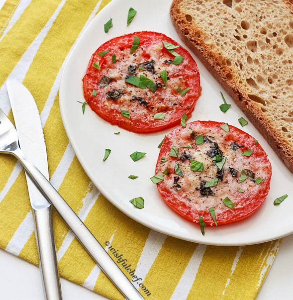 Serve the tomato slices with some crusty bread.